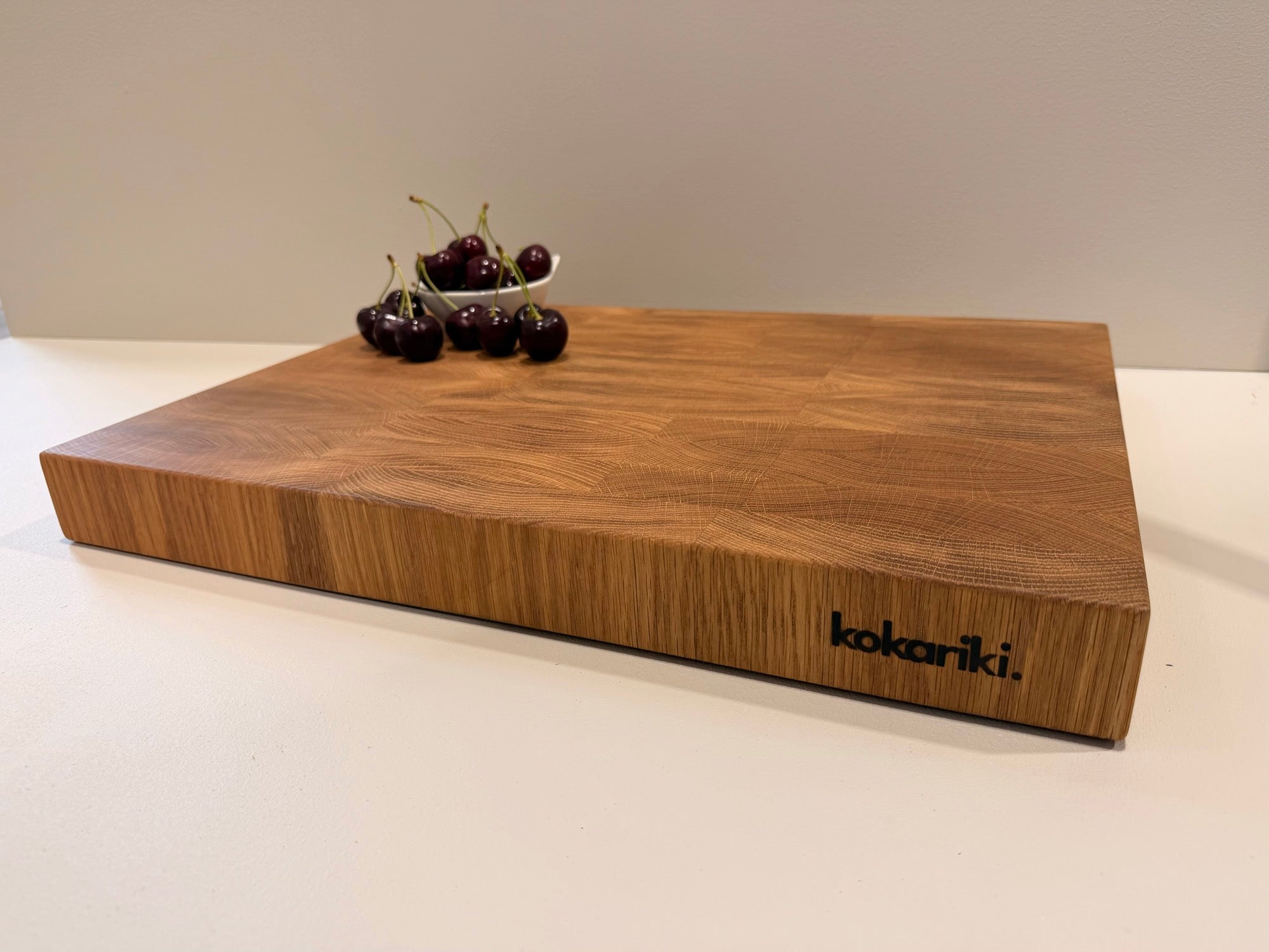 A white oak end-grain chopping block resting on the counter